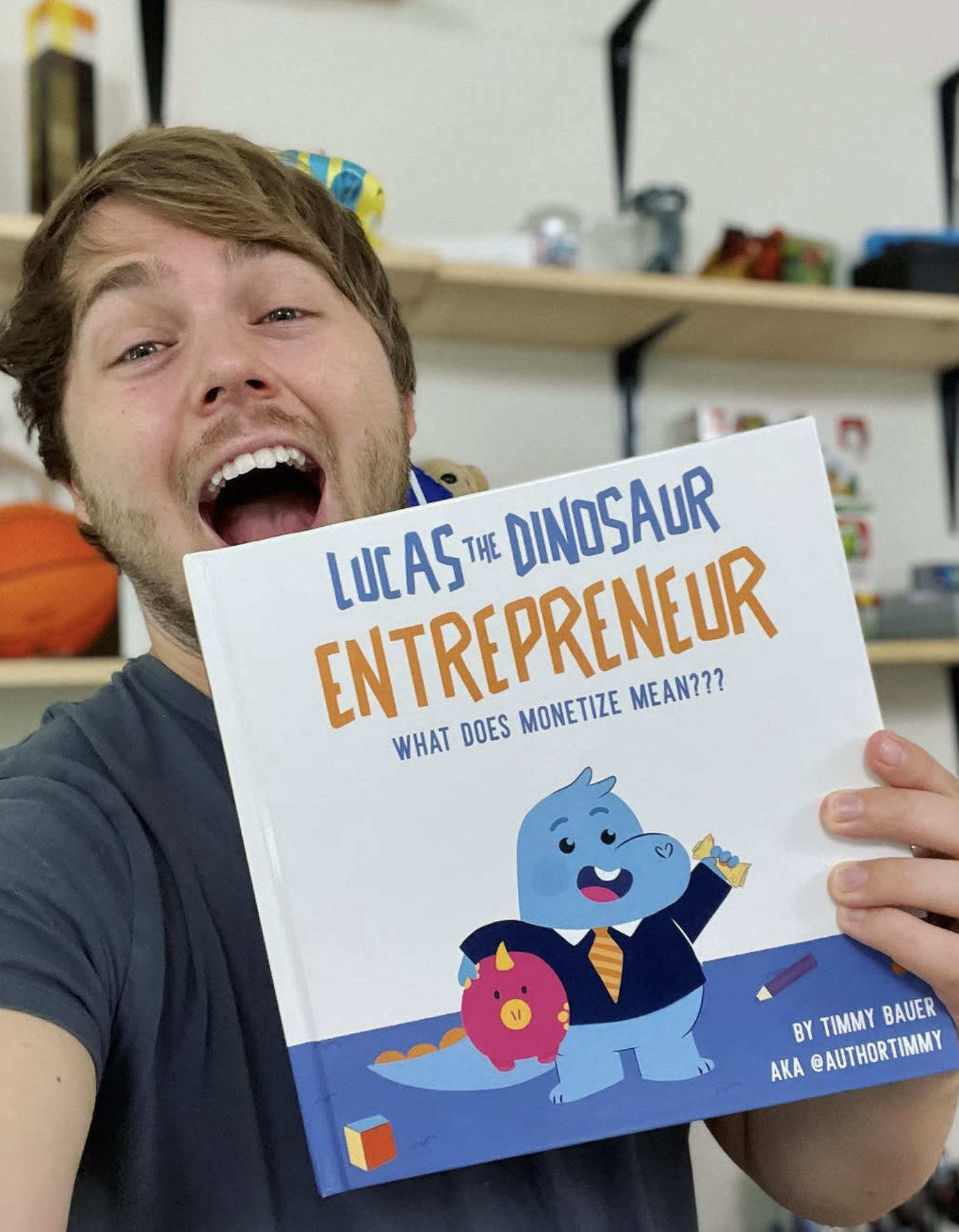 Author Timmy holding Lucas the Dinosaur Entrepreneur